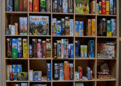 bookshelf of boardgames